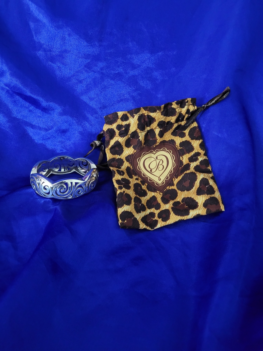 Brighton Silver-Tone Scroll Cuff with Leopard Print Pouch